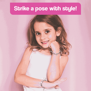 Young girl wearing handmade bracelets from Christmas-themed Bracelet-Making Kit for kids, creative motor skill toy for ages 4+