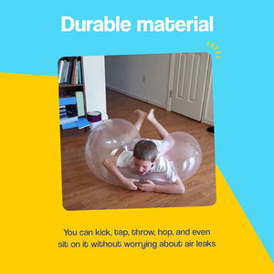 Child playing with durable Giant Jelly Balloon Ball indoors, resilient to kicks, taps, throws, and sitting.