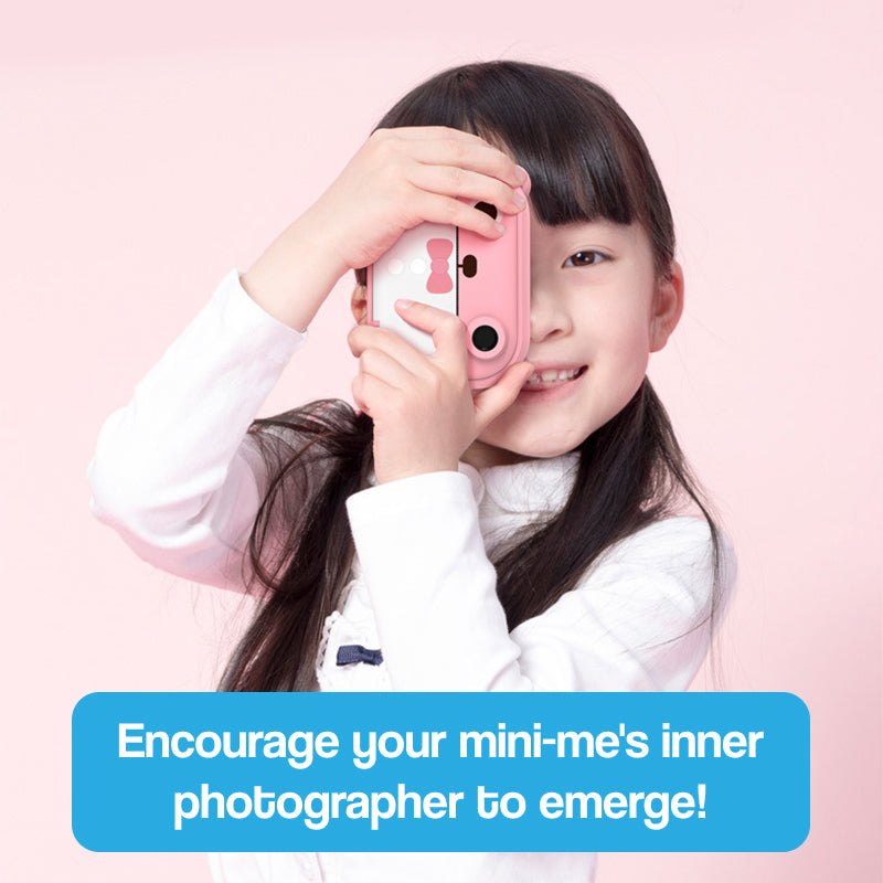 Child holding pink instant print camera encouraging young photographers creativity