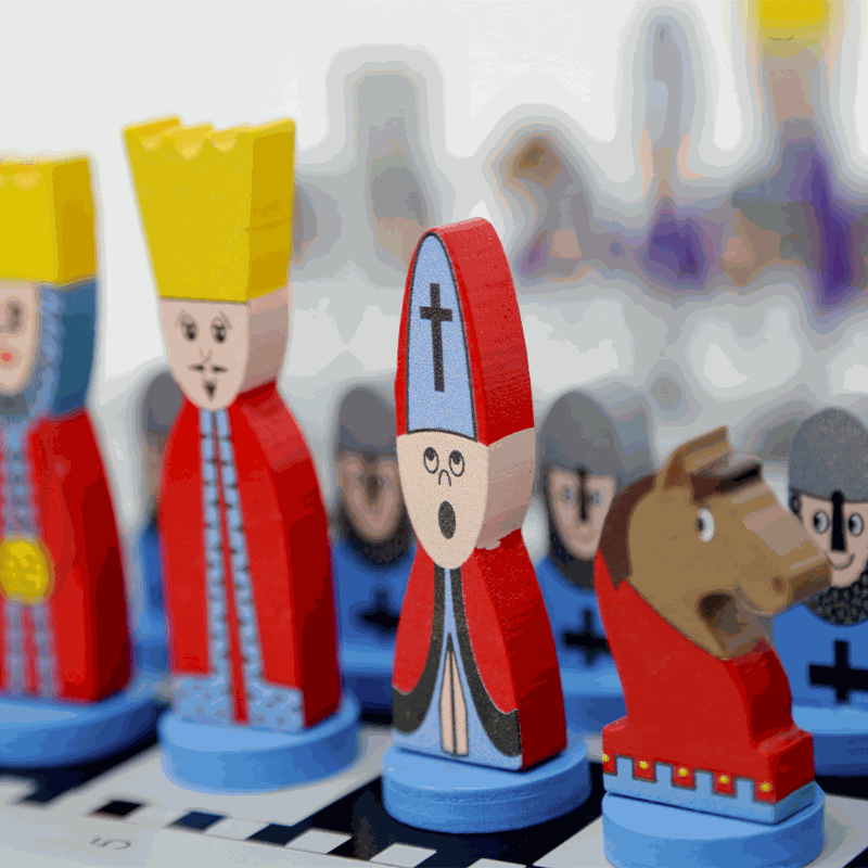 Educational Wooden Cartoon Chess Set with colorful wooden cartoon-style chess pieces on a chessboard, designed for kids' learning and fun.