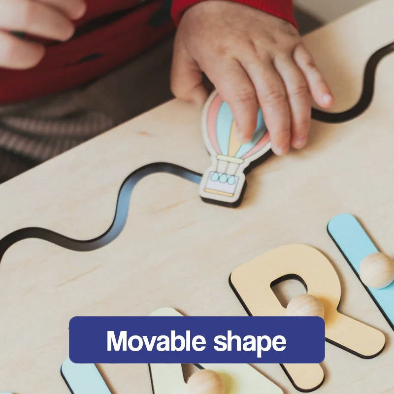Child playing with Custom Name Montessori Board wooden puzzle with movable hot air balloon shape piece
