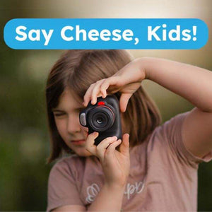 Child using Mini Photographer Digital Camera to take a photo with "Say Cheese, Kids!" text above