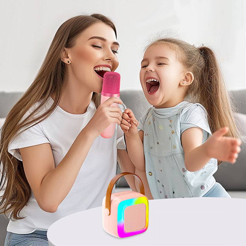 Mother and daughter singing together using Family Fun Karaoke Machine with colorful wireless speaker and microphone indoors