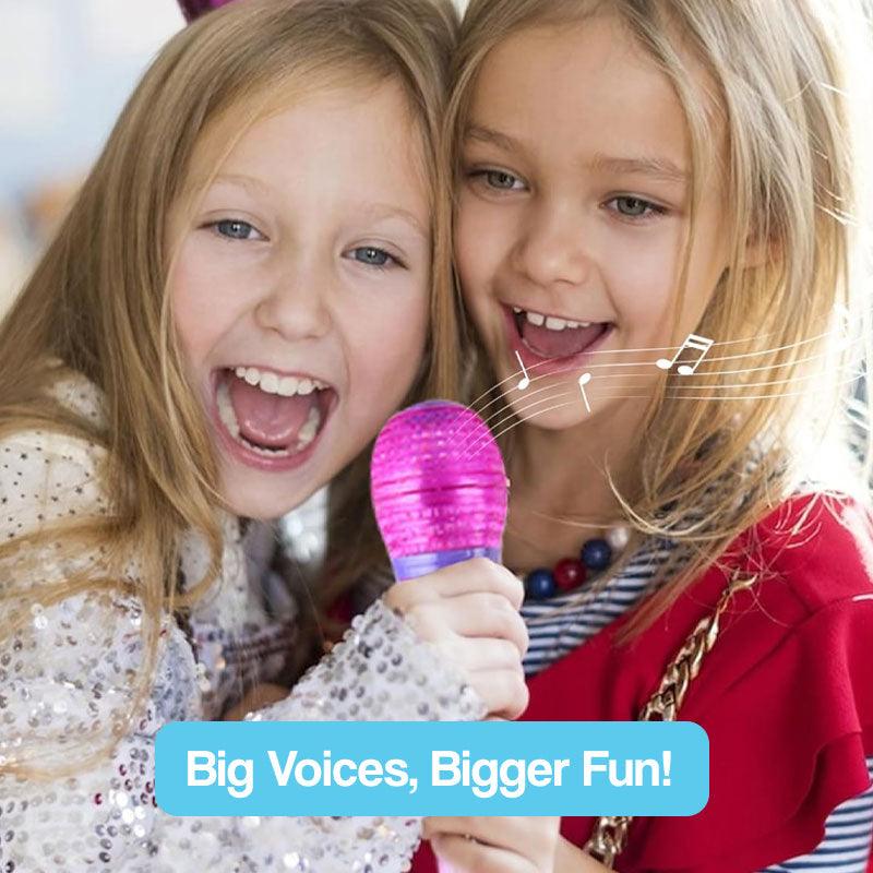 Two children singing joyfully into a bright pink microphone from the complete karaoke mic set with LED stand