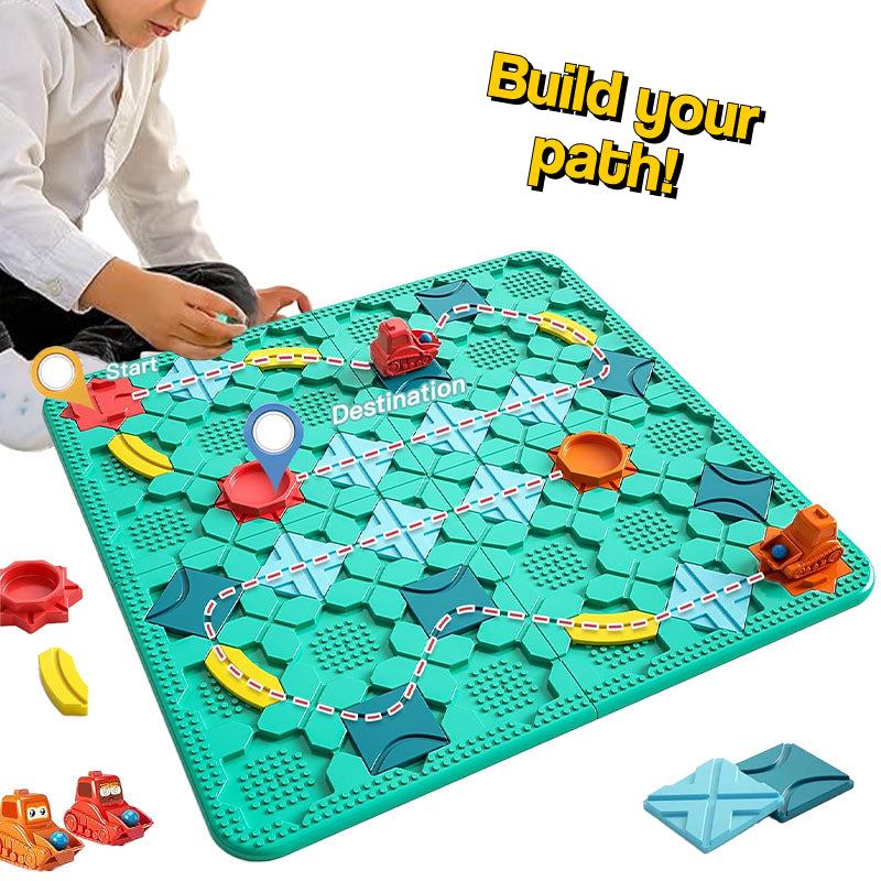 Child playing Build-A-Path Logic Puzzle STEM game with wind-up bulldozer on green board and colorful track pieces