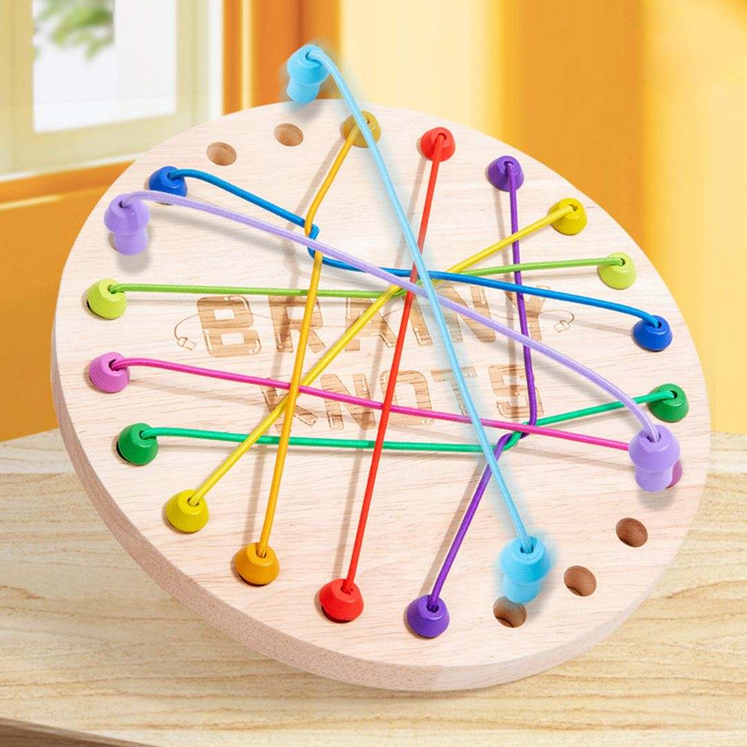 Children playing with a wooden rope untying challenge game promoting logical thinking and hand-eye coordination